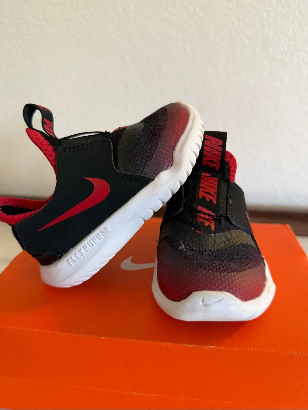 Nike Kids Black and Red Slip-On Sneakers with White Sole